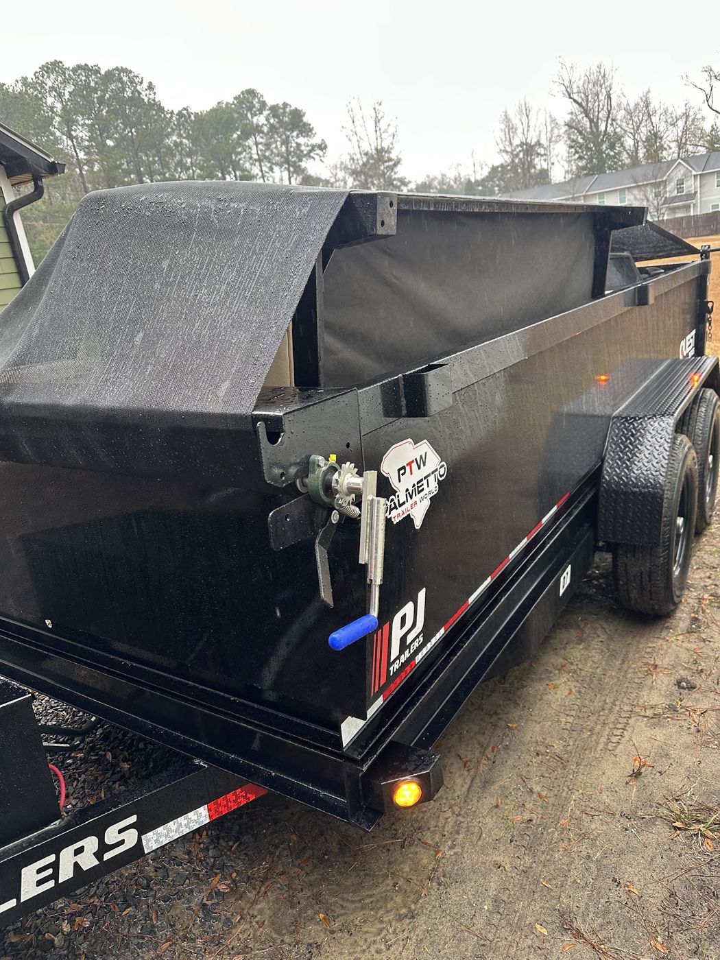 Black dump trailer on the job