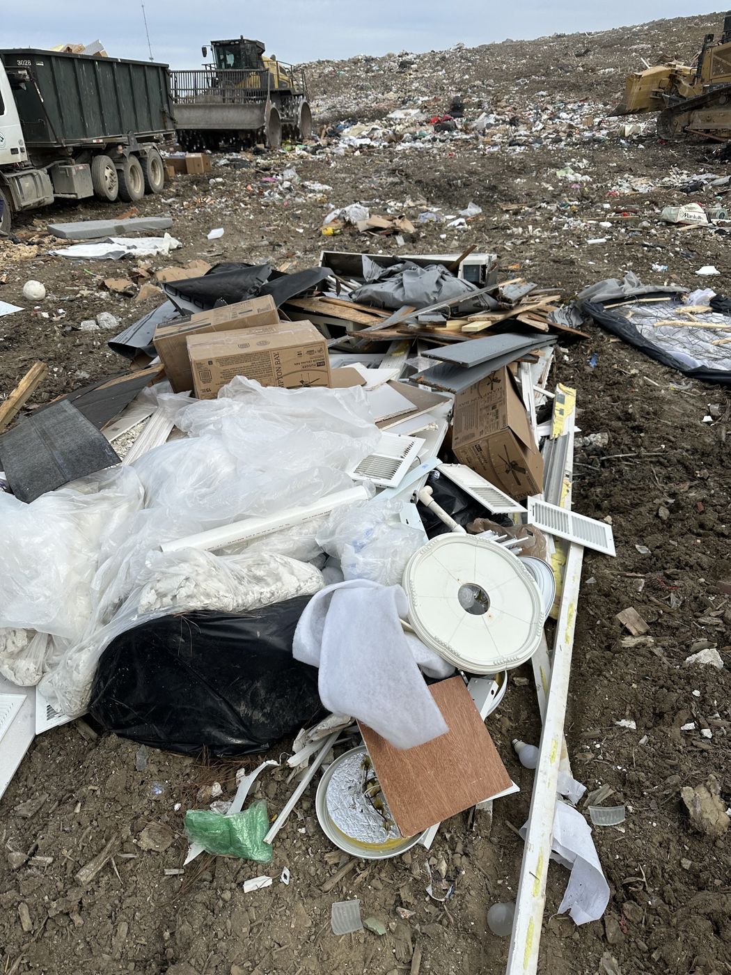 Pile of construction debris unloaded at a landfill