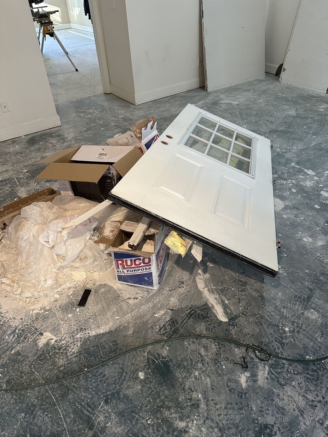 Old door and packaging inside a gutted room